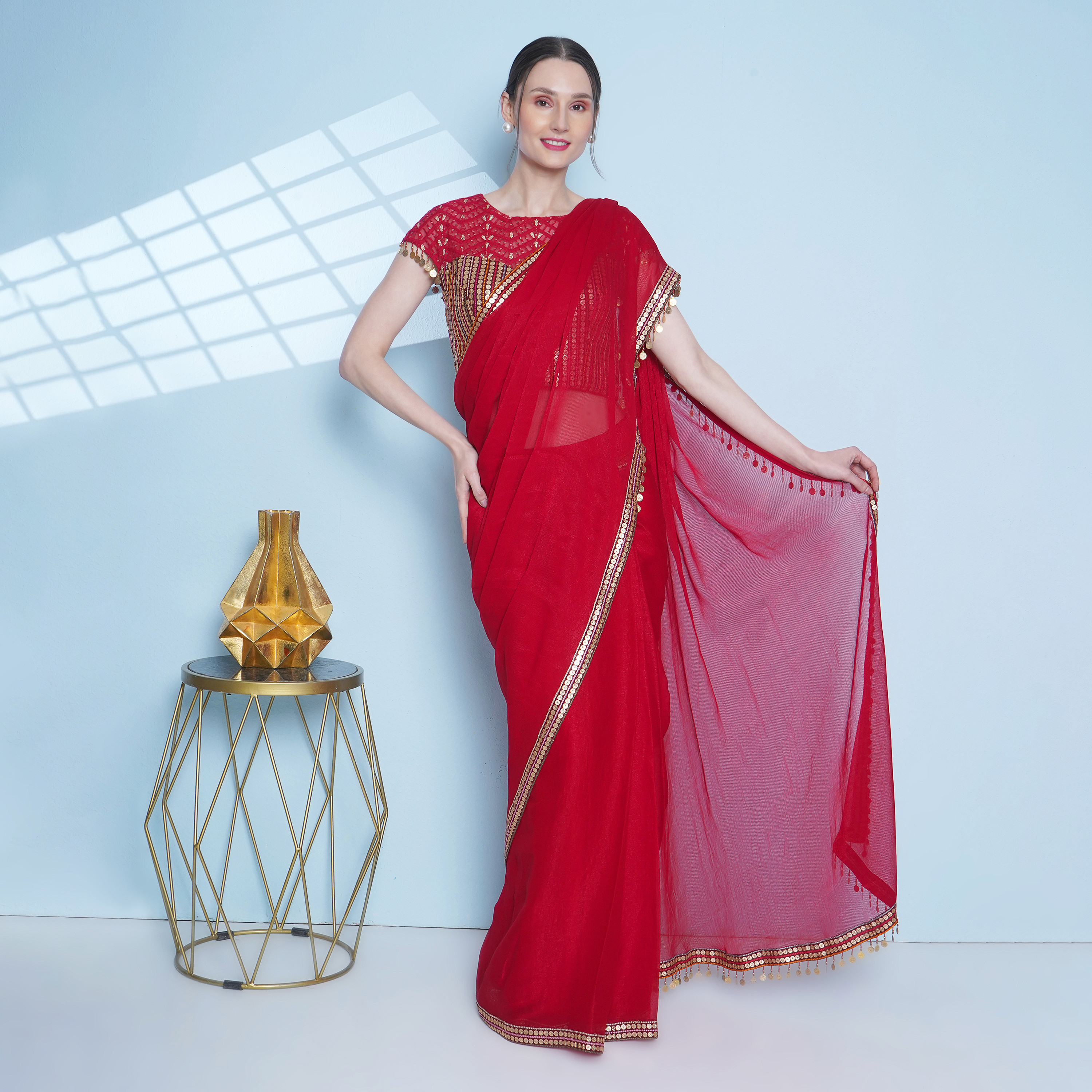 Red chiffon sari, worn with coin embroidery corset enhanced with lace